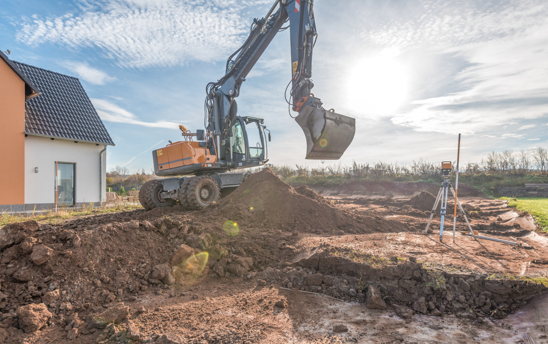 House construction, excavation with excavator House construction, excavation with excavator